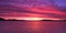 Magenta coloured altostratus cloudy Sunrise Seascape Panorama