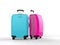 Magenta and cyan luggage suitcases