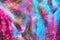 Magenta pink, blue transparent space alien glitter slime gel background texture