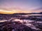 Magenta winter dawn. The icy landscape and mountains in the Russian village Teriberka