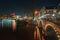 The Magere Bridge over the river Amstel with in the background t