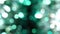 Magic abstract shiny background with silver and green defocused bokeh. Festive mood. Christmas or holiday theme
