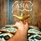 Magic Asia concept with Lamp of wishes in a hand and `Asia` text. Aladdin lamp.