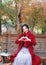 Magic autumn,Fall woman happy and bliss , Beautiful woman Sitting on a bench in autumn park