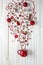 Magic Christmas cup with decorations and sweets on white wooden