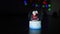 Magic Christmas glass ball with Santa and snow on the background of Christmas lights
