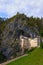 Magic landscape of medieval Predjama castle Slovene. Predjamski grad. Renaissance castle built within a cave mouth