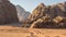 Magic mountain landscapes of Wadi Rum Desert, Jordan. Mountains in lifeless desert resemble Martian craters. Red sand and red rock