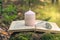 Magic still life with fluorite, quartz crystal, candle and old book. Rocks for mystic ritual, witchcraft Wiccan or spiritual