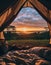 Magic sunrise seen from a tent in the pristine forest