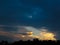 Magic sunset. Beautiful dark clouds at sunset after a thunderstorm. Dramatic and mysterious sky