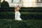 Magical beautiful young blonde bride in elegant dress walking in