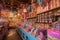 magical candy shop with shelves of colorful treats, whimsical displays, and a sprinkle of magic