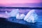 Magical charming beautiful landscape with a piece of ice like a sculpture on the Diamond beach near glacier lagoon Jokulsarlon,