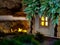 - a magical fairy-tale house in the forest. there is a light in the window