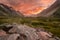 Magical First lights during hike at dawn with the sky on fire over Mount Cook in New Zealand