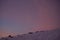 Magical fog around. Pink sky, snow all around, skiing resort beauty.