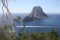The magical island of Es Vedra with the small islet of Es Vedranell next to it in front of the coast of Cala d`Hort in the touris