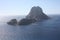 The magical island of Es Vedra with the small islet of Es Vedranell next to it in front of the coast of Cala d`Hort in the touris