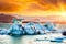 Magical landscape with ice deep in the form of a shark  in the famous Jokulsarlon glacial lagoon in Iceland at sunset. Exotic