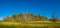 Magical panoramic view of deciduous forest in early Spring with blue sky, near Magdeburg, Germany