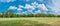 Magical panoramic view of deciduous forest in Summer with blue sky and clouds, near Magdeburg, Germany, sunny morning