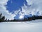 A magical play of sunlight and shadow during the alpine winter on the snowy slopes of the Churfirsten mountain range