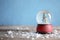 Magical snow globe with Christmas tree on table against color background. Space for text