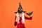 Magical spell. Small witch with white hair. Wizard or magician. Halloween party. Photo booth props. Small girl in black