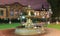 Magical square with fountain, antique clock and small statues at night in Irkutsk