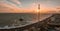 Magical sunset aerial view of British Airways i360 viewing tower pod with tourists in Brighton