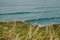 Magical view of the Atlantic Ocean with Waves and some Surfers.