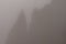 Magical view of the top of Spitz mountain in the Carpathian Mountains, Spitz mountain in the fog, mystical and scary.