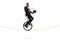 Magician holding a wand and a hat and riding a unicycle on a rope