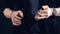 Magician is twisting a glass ball between his fingers, close up.