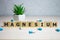 Magnesium word on wooden cubes, mineral complex or supplement for a healthy lifestyle, medical concept, background