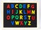 Magnet plastic alphabet on blackboard