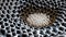 Magnetic Beauty: Exploring Macro Details of White Ferrofluid\\\'s Hexagonal Biogenic Structures