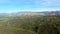 Magnificent aerial shot of beautiful forest with high hills on a background