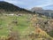 Magnificent autumn colors in the surroundings of mountain pastures and mixed forests on the slopes of the Swiss Alps, Ilanz