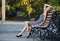 Magnificent brunette sits on bench