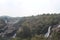 A magnificent fall view in India from the distance. Rock structure has covered most of the area around the fall