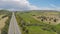 Magnificent flyover above green agricultural fields and meadows of Cyprus