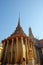 A magnificent gilded Buddhist temple with a colonnade