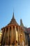 A magnificent gilded Buddhist temple with a colonnade