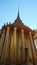 A magnificent gilded Buddhist temple with a colonnade