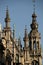 Magnificent high-rise building featuring ornate towers and statues in Brussels against a blue sky