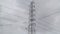 Magnificent high voltage electricity transmission tower and lines with cloudy sky bakground