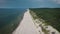 Magnificent landscape of the Curonian Spit beach. Baltic coast and forest in the frame