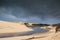 magnificent landscape of the Huchet stream and its dunes and a stormy sky